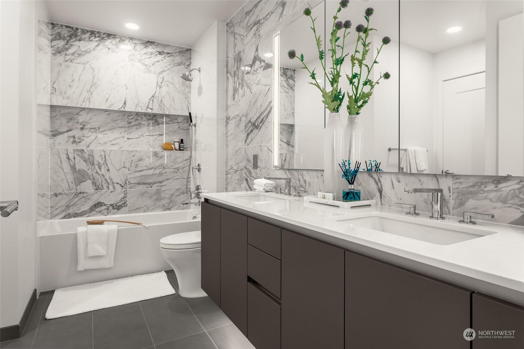 Double vanity, double entrance from living room and bedroom to the bathroom.