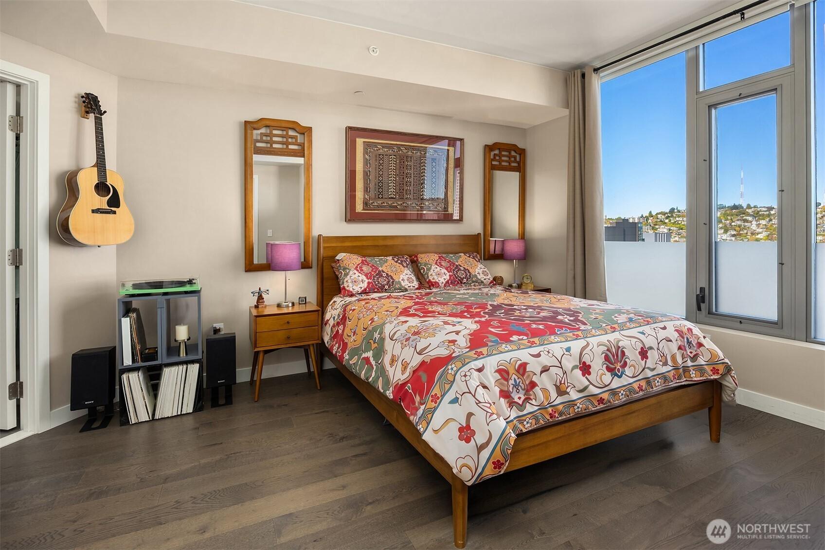 Spacious bedroom with bathroom entry on the left.