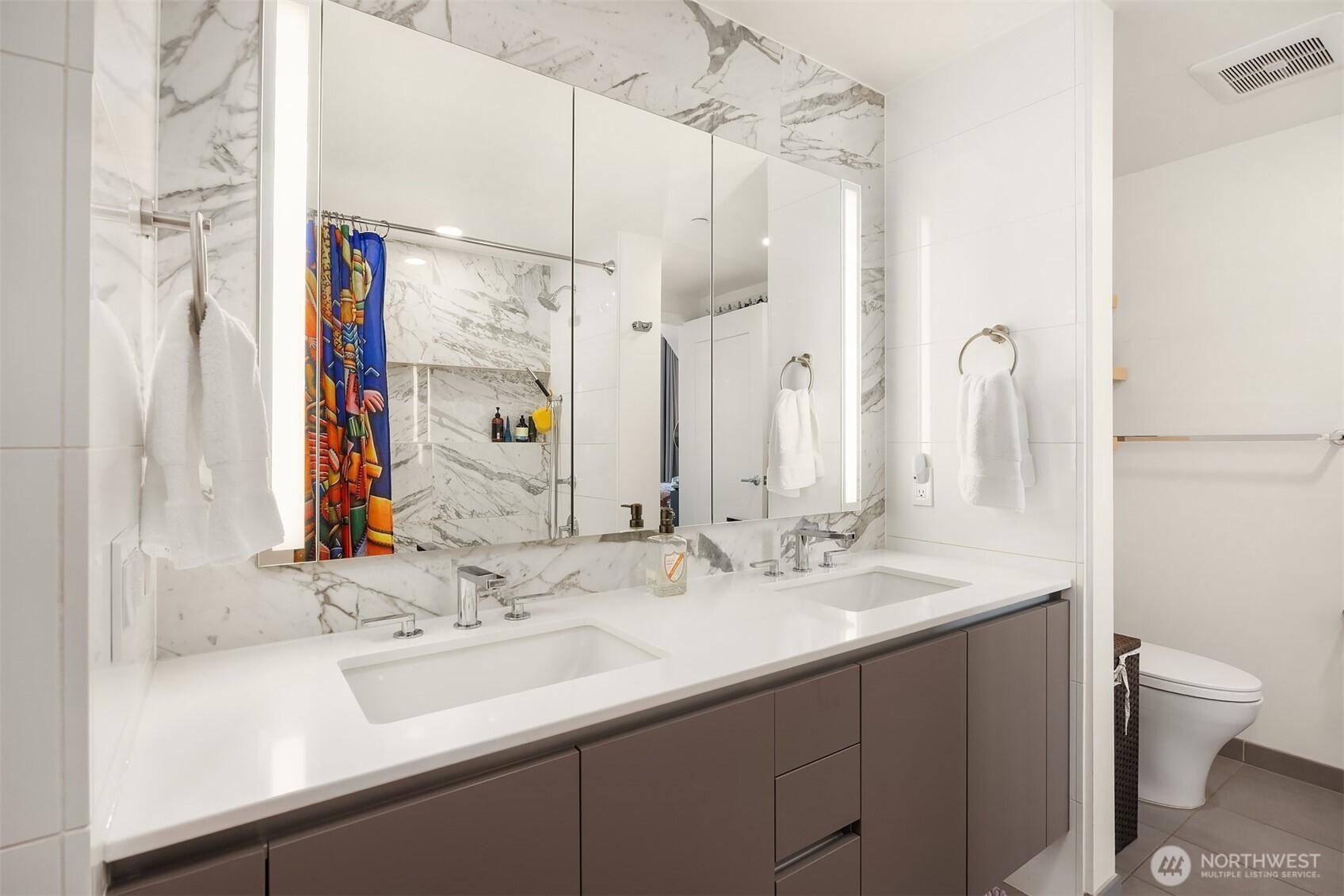 Large bathroom with two entries; one from the entry and one from the bedroom.