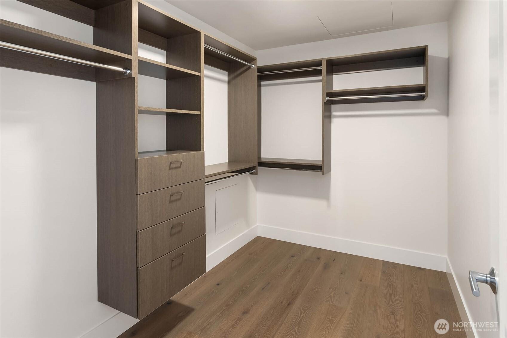 Primary bedroom walk-in closet